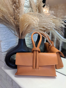 The leather loop clutch bag