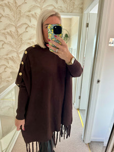 The tassel poncho style jumper with gold button detailing