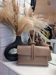 The leather loop clutch bag