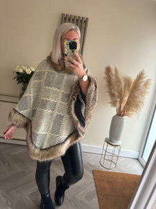 The faux fur trim cape