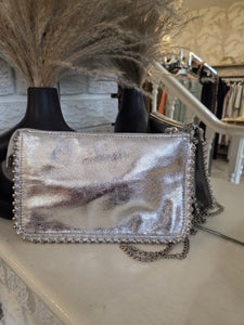 The metallic studded clutch bag with separate shoulder chain