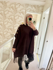 The tassel poncho style jumper with gold button detailing