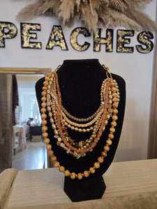 The Bora beaded necklace in golds & amber