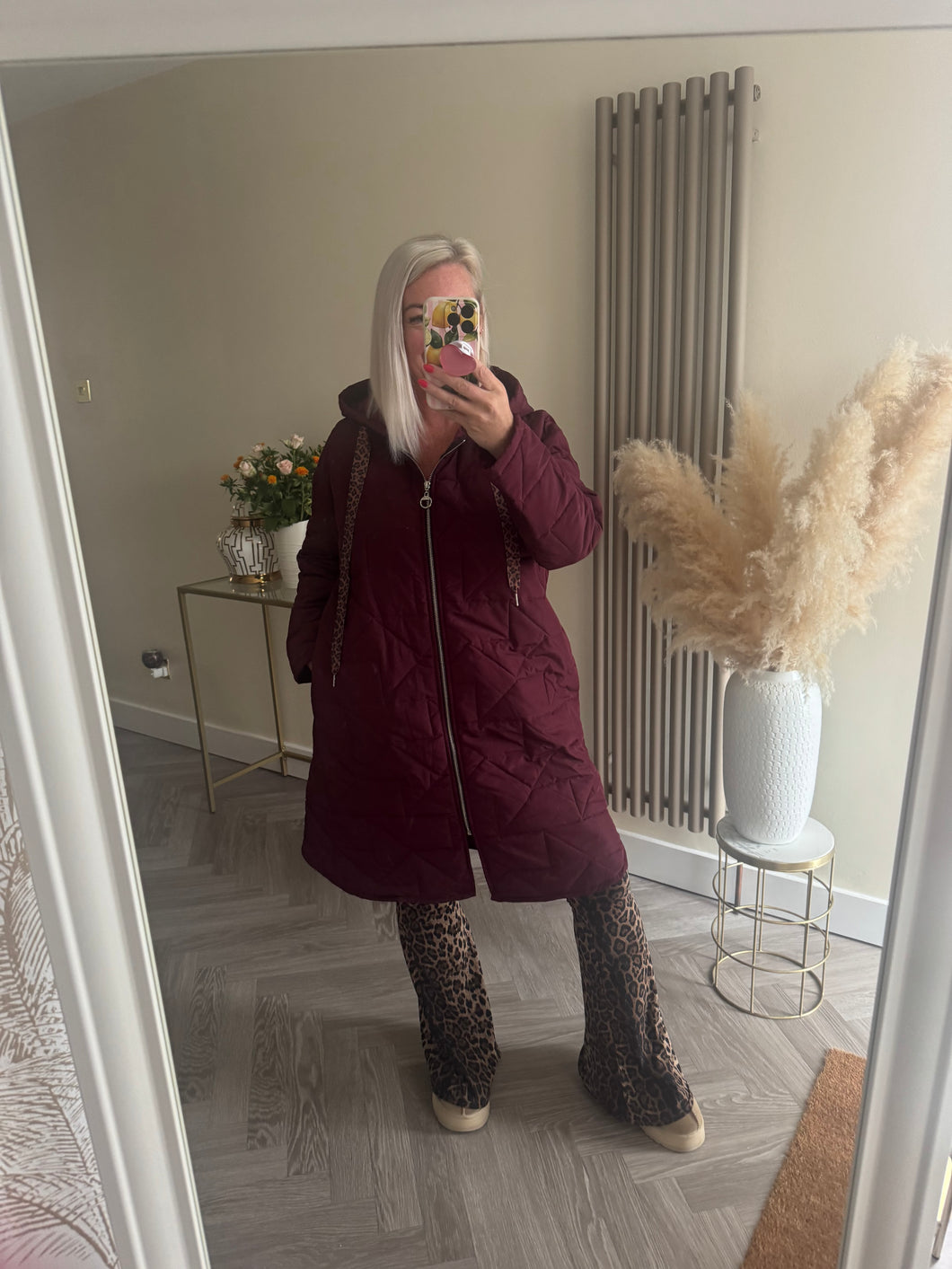 The Bella quilted coat with animal print ties